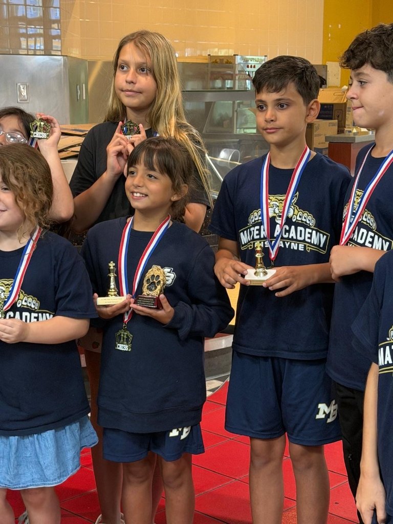 Young players receiving chess tournament awards